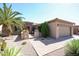 Paver walkway to the front door with well maintained desert landscaping at 19437 N Guardian Ln, Surprise, AZ 85387