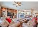 Open living room with leather seating and bright natural light at 19437 N Guardian Ln, Surprise, AZ 85387