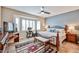 Serene main bedroom with a bay window, comfortable furnishings, and stylish decor for a relaxing retreat at 19437 N Guardian Ln, Surprise, AZ 85387