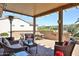 Covered patio area with outdoor furniture for relaxing and entertaining at 19437 N Guardian Ln, Surprise, AZ 85387