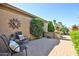 Cozy brick patio with chairs and decor at 19437 N Guardian Ln, Surprise, AZ 85387