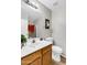 Bathroom with white sink, mirror, and shower, offering a clean and functional space at 2015 S 80Th Ln, Phoenix, AZ 85043