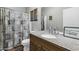 Elegant bathroom featuring a decorative shower curtain and a granite countertop vanity at 2015 S 80Th Ln, Phoenix, AZ 85043