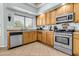 Functional kitchen with stainless steel appliances and plenty of counter space at 2015 S 80Th Ln, Phoenix, AZ 85043