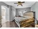 Spacious main bedroom featuring an arched entry and large bed with a decorative headboard at 2015 S 80Th Ln, Phoenix, AZ 85043