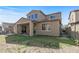 Charming backyard view showcasing the covered patio and expansive lawn, perfect for outdoor enjoyment and relaxation at 20646 W Delaney Dr, Buckeye, AZ 85396