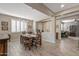 Bright dining room with wood floors, large window, and modern chandelier at 20646 W Delaney Dr, Buckeye, AZ 85396