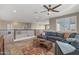 Open upstairs living room features a neutral color palette, sectional sofa, and balcony at 20646 W Delaney Dr, Buckeye, AZ 85396