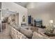 Bright living room with staircase, comfortable seating, and modern decor at 20646 W Delaney Dr, Buckeye, AZ 85396