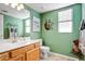 Bathroom featuring a wood vanity, neutral countertops, and a decorative mirror at 2130 E Knudsen Dr, Phoenix, AZ 85024