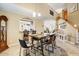 Dining room with travertine floors and a pass-through to the kitchen at 2130 E Knudsen Dr, Phoenix, AZ 85024