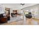 Open concept living room and kitchen area with tile flooring and ample natural light from the sliding glass door at 2130 E Knudsen Dr, Phoenix, AZ 85024