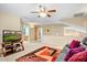 Upstairs living area with carpet, ceiling fan, and comfortable seating, perfect for relaxing or entertaining guests at 2130 E Knudsen Dr, Phoenix, AZ 85024