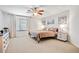 Spacious main bedroom with carpet, a ceiling fan, and bright windows that let in lots of natural light at 2130 E Knudsen Dr, Phoenix, AZ 85024