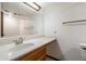 Bright bathroom features a long counter and a mirror at 2205 E Fox St, Mesa, AZ 85213