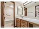 Neat bathroom featuring a tub, and wooden vanity with a mirror at 2205 E Fox St, Mesa, AZ 85213