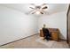 Simple bedroom with a ceiling fan, carpet, and wooden desk set at 2205 E Fox St, Mesa, AZ 85213