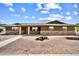 Charming single-story home showcasing a well-kept exterior with beautiful brick accents and mature landscaping at 2205 E Fox St, Mesa, AZ 85213