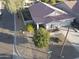 Aerial view of a neighborhood showcasing well-maintained homes, desert landscaping, and wide streets at 28249 N Shundeen Cir, San Tan Valley, AZ 85143