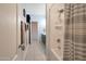 Clean bathroom showcasing a shower with a striped curtain and towels hanging by the door at 28249 N Shundeen Cir, San Tan Valley, AZ 85143