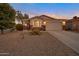 Charming single-Gathering home with desert landscaping, a two-car garage, and a brick facade at 28249 N Shundeen Cir, San Tan Valley, AZ 85143