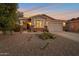 Charming single-story home boasts desert landscaping, a two-car garage, and a welcoming front porch at 28249 N Shundeen Cir, San Tan Valley, AZ 85143