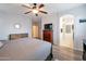 Spacious main bedroom boasting wood-look floors and an open layout leading to the bathroom at 28249 N Shundeen Cir, San Tan Valley, AZ 85143