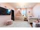 Lovely pink bedroom with a crib, single bed, and charming decor at 30439 W Peakview Rd, Wittmann, AZ 85361