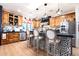 Spacious kitchen with a large island featuring black and white tile and stainless steel appliances at 30439 W Peakview Rd, Wittmann, AZ 85361