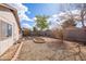 Spacious backyard featuring a rock garden, fire pit, a block wall for privacy, and some desert landscaping at 3151 W Donald Dr, Phoenix, AZ 85027