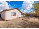 The rear of the home features a xeriscaped backyard with a fire pit and block wall for added privacy at 3151 W Donald Dr, Phoenix, AZ 85027