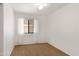 Cozy bedroom features a ceiling fan, neutral carpet and a window for natural light at 3151 W Donald Dr, Phoenix, AZ 85027