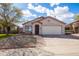 Beautiful single-story home with desert landscaping, brick accents, and well-maintained lawn at 3151 W Donald Dr, Phoenix, AZ 85027