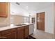 Charming kitchen with a view to the living area offers ample cabinet storage at 3151 W Donald Dr, Phoenix, AZ 85027