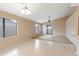 Open-concept living area with tile and carpet flooring and a sliding glass door at 3151 W Donald Dr, Phoenix, AZ 85027