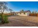 Large backyard showcasing desert landscaping, wood fencing, and solar panels at 331 W Stanford Ave, Gilbert, AZ 85233