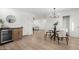 Open-concept view of dining area with a modern chandelier and access to the living area at 331 W Stanford Ave, Gilbert, AZ 85233