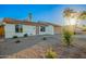 Attractive exterior showcasing desert landscaping, a neutral color scheme, and attached two-car garage at 331 W Stanford Ave, Gilbert, AZ 85233