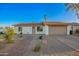 Inviting single-story home featuring a neutral palette, attached garage, and desert landscaping at 331 W Stanford Ave, Gilbert, AZ 85233