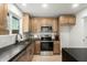 Updated kitchen featuring stainless steel appliances, warm cabinetry, and light countertops at 331 W Stanford Ave, Gilbert, AZ 85233