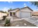 Charming single-story home with a well-maintained front yard and attached two-car garage at 34717 N Picket Post Dr, San Tan Valley, AZ 85144