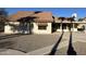 Rear exterior elevation showcasing the yard and covered patio at 3703 N Wintergreen Way, Avondale, AZ 85392