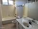 Bright bathroom featuring a shower-tub combo and single sink vanity with white countertop at 3703 N Wintergreen Way, Avondale, AZ 85392