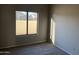 Bedroom featuring carpet floors, neutral walls, and a view of the backyard at 3703 N Wintergreen Way, Avondale, AZ 85392