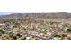 A scenic aerial view of a residential area, showcasing neighborhood streets and desert hills in the distance at 3826 E Equestrian Trl, Phoenix, AZ 85044