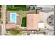 Top-down aerial showcasing layout of property with pool, lawn and patio at 3826 E Equestrian Trl, Phoenix, AZ 85044