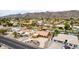 An aerial view of a residential neighborhood with mountain views and backyard pools at 3826 E Equestrian Trl, Phoenix, AZ 85044