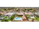 An aerial view featuring a residential neighborhood and multiple homes with pools at 3826 E Equestrian Trl, Phoenix, AZ 85044