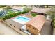 An aerial view of a fenced backyard featuring a swimming pool and covered patio at 3826 E Equestrian Trl, Phoenix, AZ 85044