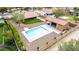 Aerial view of a fenced backyard featuring a pool and a covered patio at 3826 E Equestrian Trl, Phoenix, AZ 85044